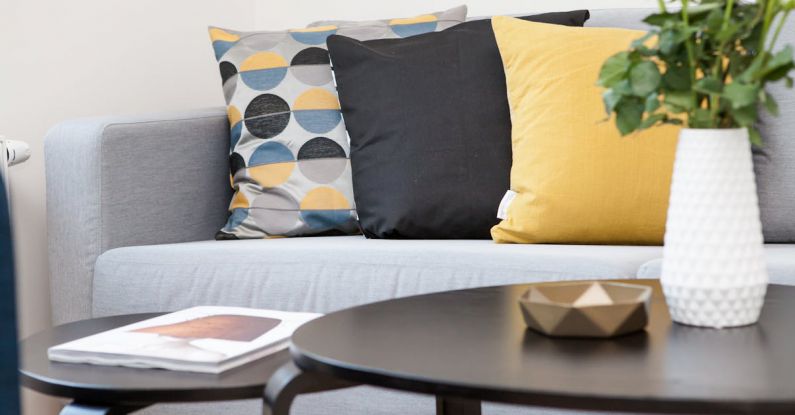 Pillows - Centerpiece on Coffee Table Beside Sofa With Three Pillows