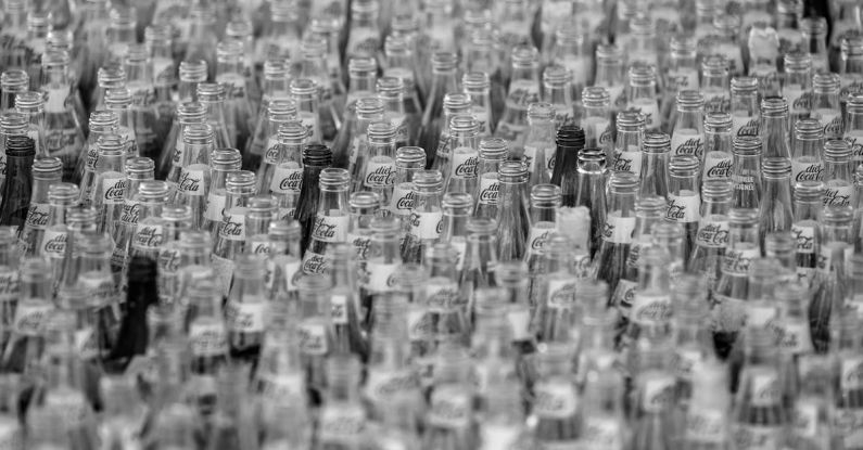 Glass Bottles - Selective Focus Photo of Bottles