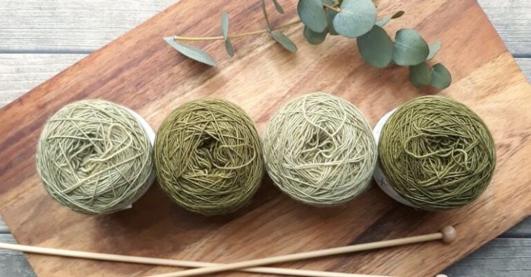 Knitting - Four Green Yarns on Chopping Board